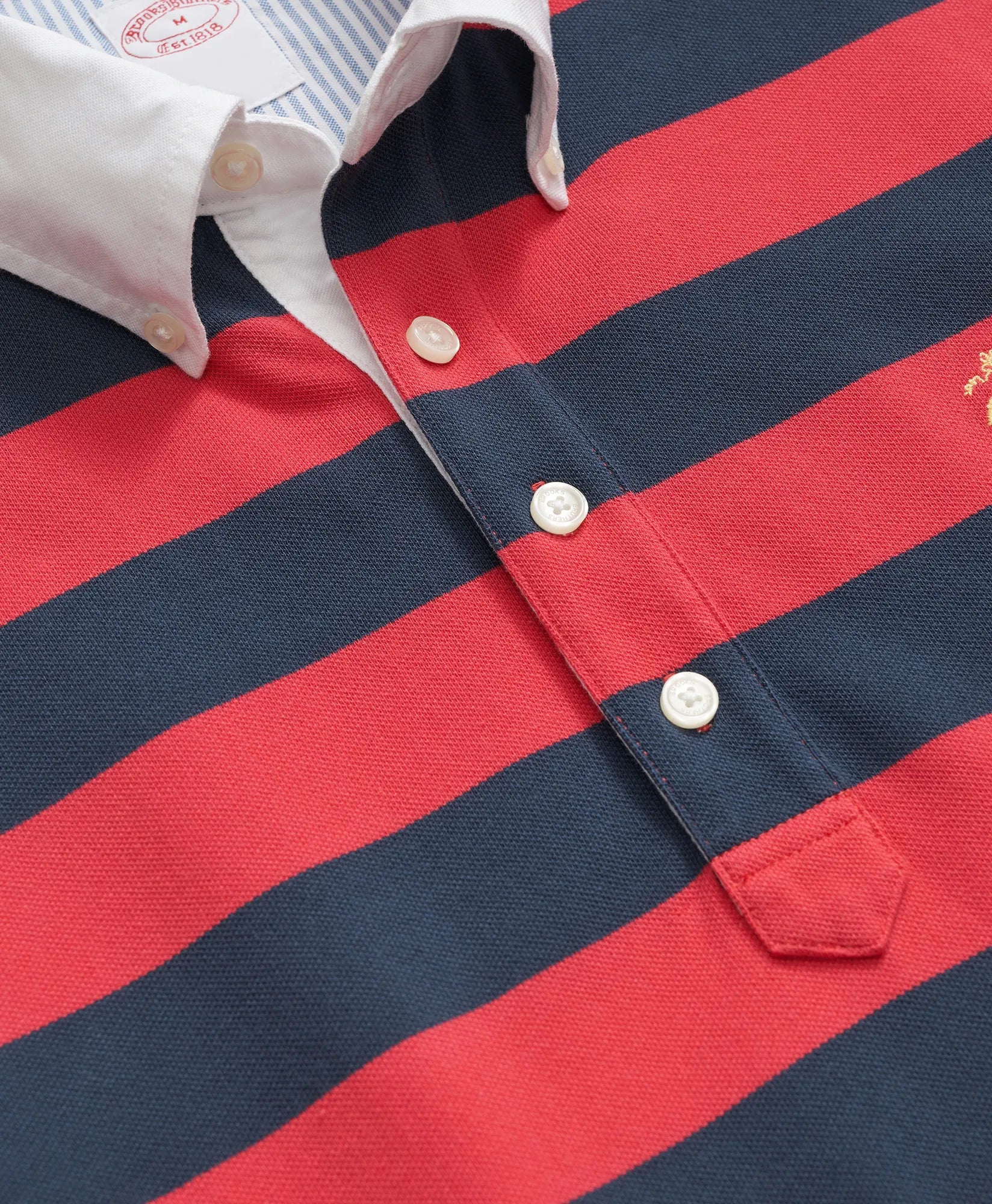 KNT SS STP VTG POLO NAVY/RED